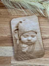 Front view of the custom wooden birth card featuring a meticulously engraved baby photo, ideal for a one-of-a-kind baby announcement or newborn keepsake.