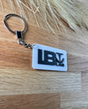 Bold branding displayed on the front of the 3D printed keychain, perfect for a business giveaway or customer appreciation event