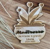 Personalized wooden magnet in the shape of a flower pot, styled on a fridge. A unique and decorative touch to any home or workspace.